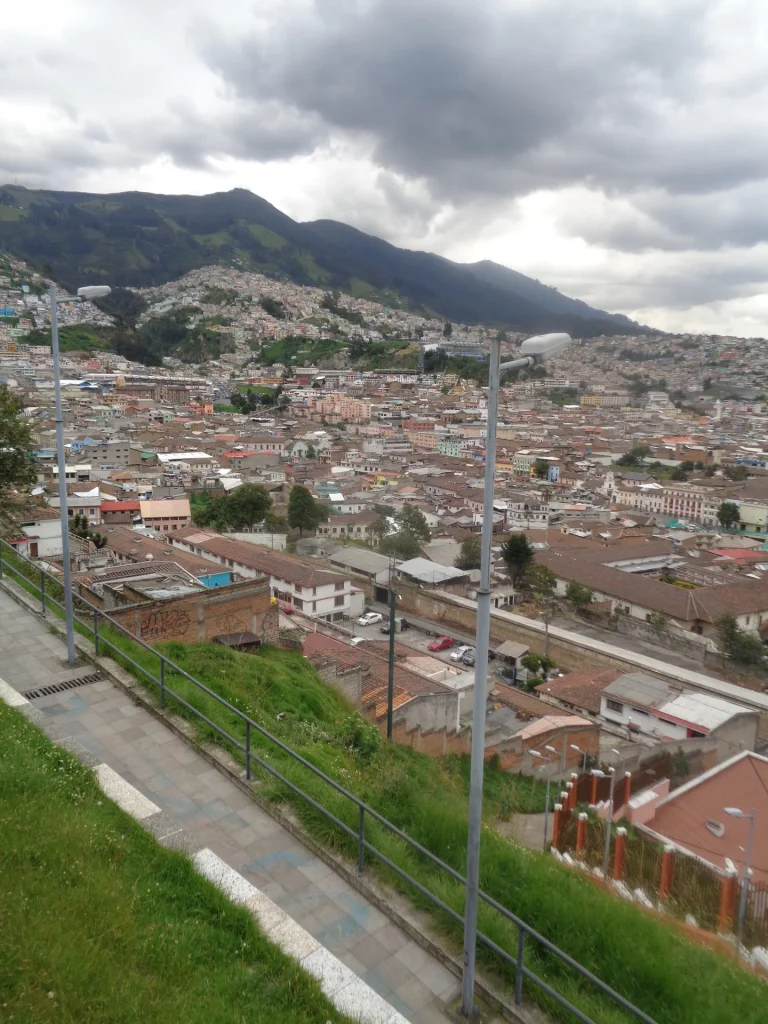 Quito’s hillside cityscape seen beside a stepped public path