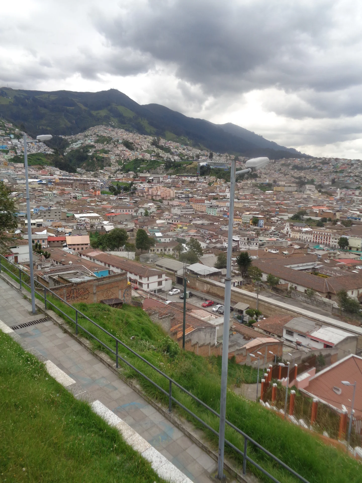 Quito’s hillside cityscape seen beside a stepped public path