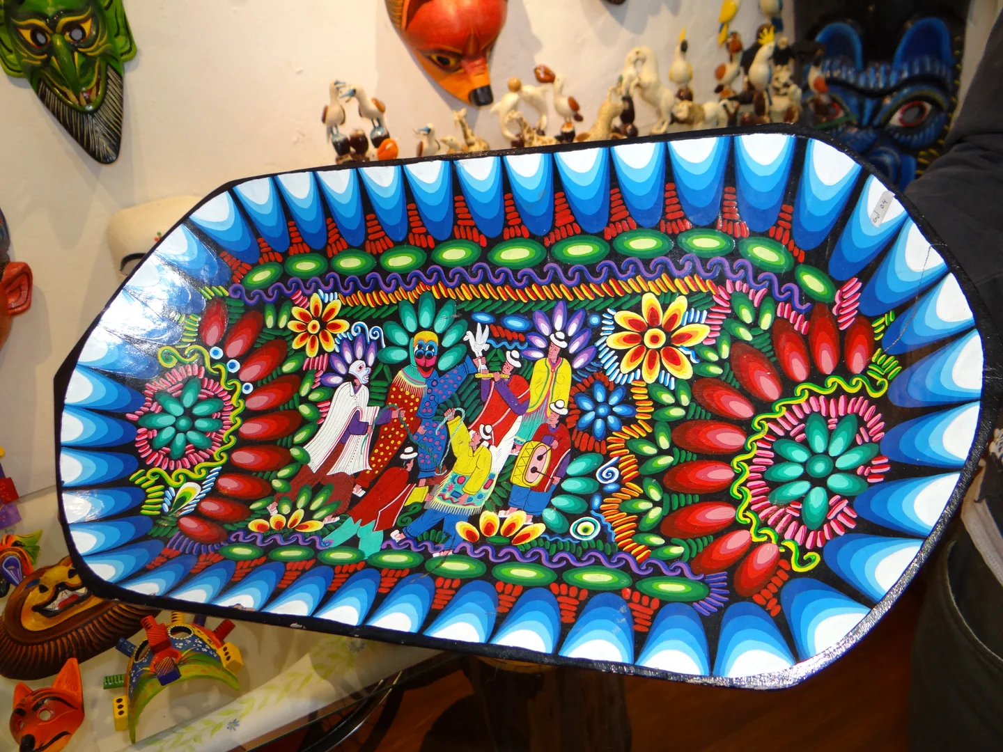 Carved and painted wooden trays photographed in Quito